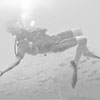 Student diver swimming backwards
